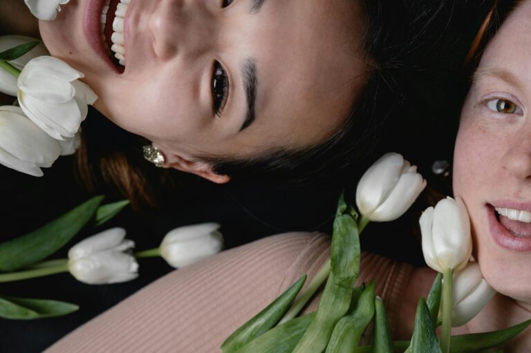 women smiling with flowers
