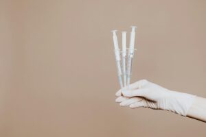image for lipotropic injections and medication interactions where it shows a hand holding three syringes
